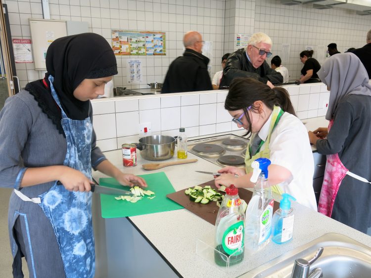 Pupils of Bow School cooking lunch for The Geezers