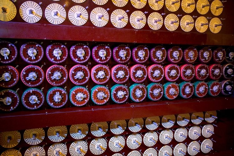 Working replica of Bombe machine in National Museum of computing just outside the fence at Bletchley Park.