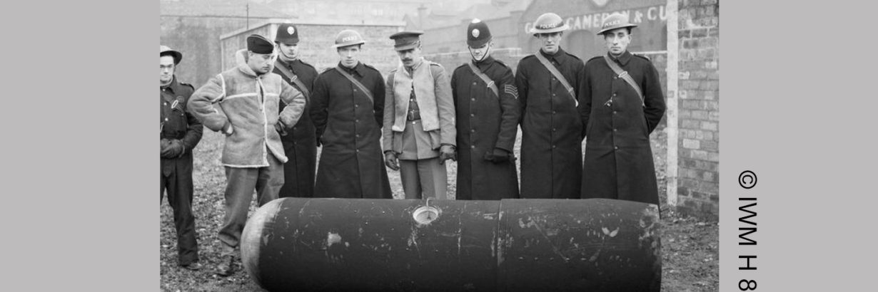 Photo courtesy of the Imperial War Museum (© IWM H 8281). It shows Police and Army bomb disposal officers with a defused German 1000kg 'Luftmine' (parachute mine) in Glasgow, 18 March 1941.